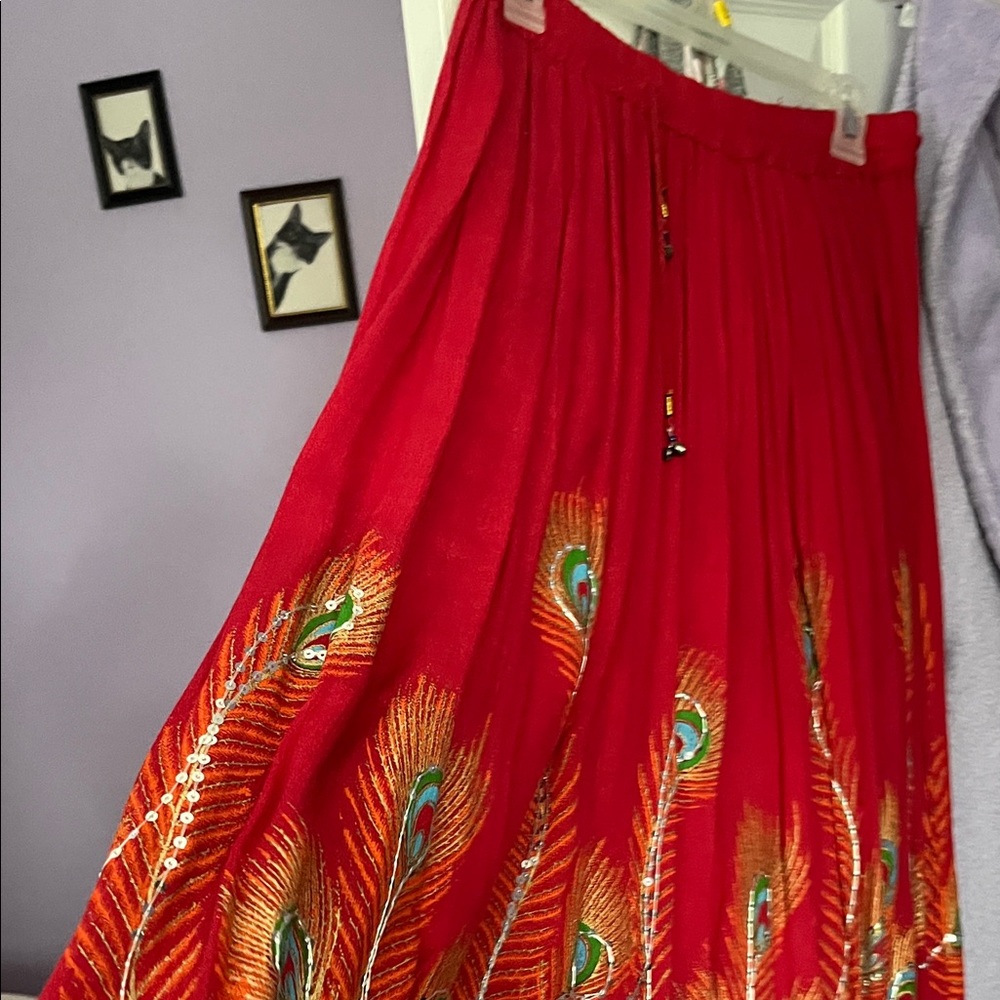 EARTHBOUND Scarlet Maxi Skirt with Peacock Feather Motif